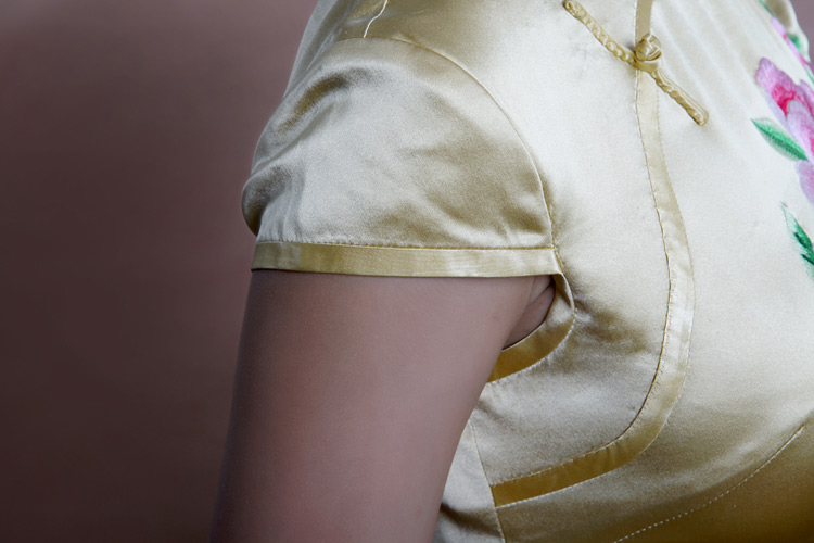 Light golden cheongsam with peonys embroidery Light golden cheongsam with peonys embroidery